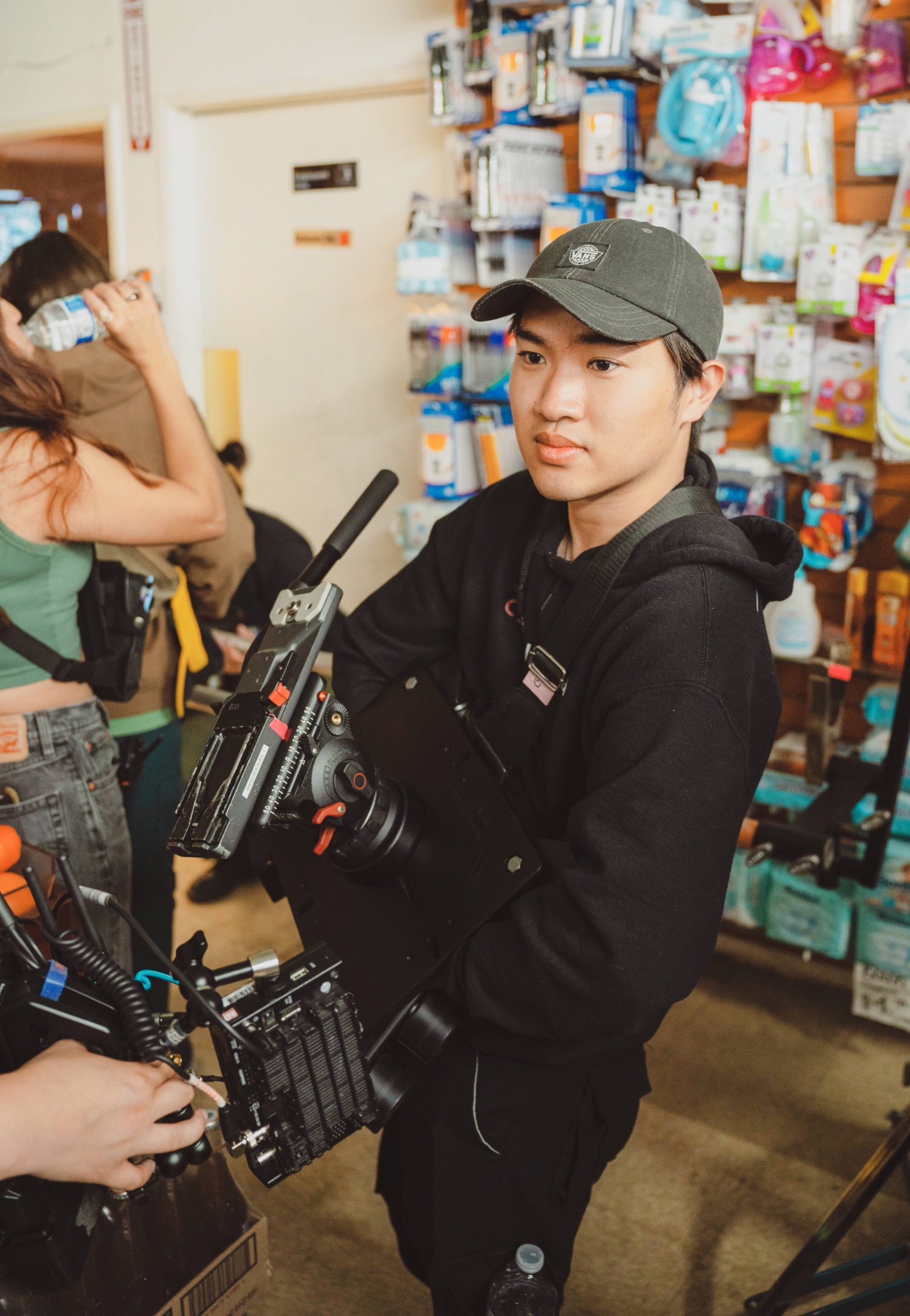 Nicholas Tjen working with a cinema camera on set
